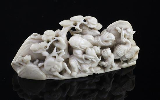 A Chinese ivory figural brush rest, 18th century, length 9.7cm